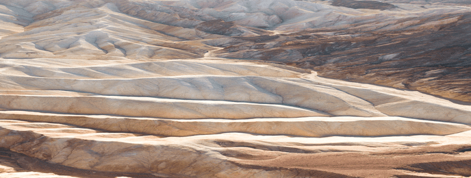 Structural shot of white light gray rock from above